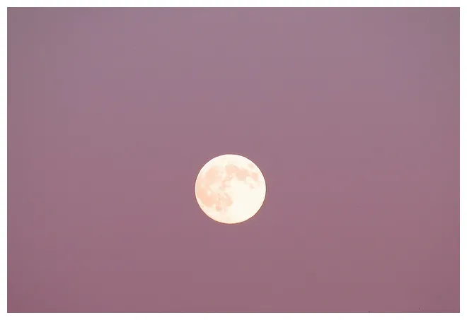 Full moon in purple sky